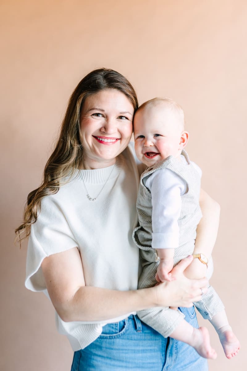 Kenzie Scott, M.S. CCC-SLP, holding a smiling baby